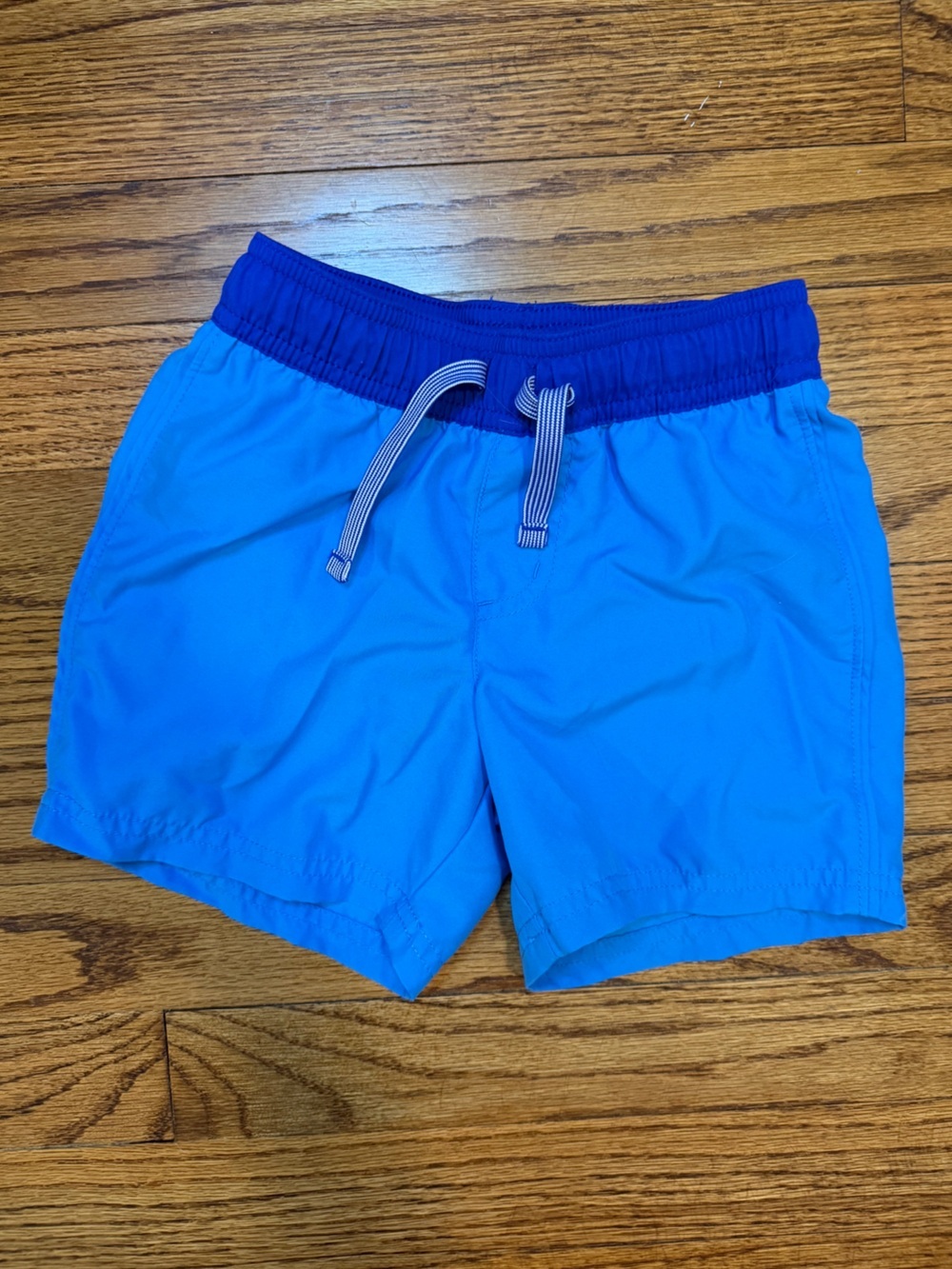 Boys Cat & Jack blue Colorblock swim trunks. Size: XS (4-5)